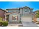 Charming two-story home featuring a gray facade, red tile roof, and well-maintained landscaping at 9021 Rendon St, Las Vegas, NV 89143