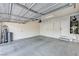 Spacious two car garage with concrete floors and garage door with automatic opener at 9021 Rendon St, Las Vegas, NV 89143