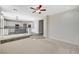 Open-concept living space featuring neutral walls, a ceiling fan, and transitions to the kitchen on a split level at 9021 Rendon St, Las Vegas, NV 89143