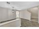 Well-lit living area with modern floors, neutral paint, and access to the stairway and an adjacent room at 9021 Rendon St, Las Vegas, NV 89143