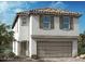 Charming two-story home featuring a symmetrical facade and attached two-car garage at 9534 Marsh Aster St, Las Vegas, NV 89139