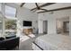 Open concept main bedroom with views to deck and seating area with mountain views at 10271 Meridian Hill Ave, Las Vegas, NV 89135