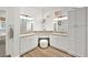 Bright bathroom featuring dual vanities, white cabinetry, and a separate tub area at 10920 Grand Haven Ave, Las Vegas, NV 89134