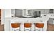 Modern kitchen features sleek gray cabinets, stainless steel appliances, and a stylish breakfast bar at 10920 Grand Haven Ave, Las Vegas, NV 89134