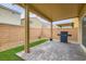 This backyard patio features low-maintenance turf and brick pavers, ideal for outdoor entertaining at 113 Manzanita Falls Ave, North Las Vegas, NV 89031