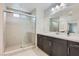 Contemporary bathroom featuring a glass-enclosed shower and quartz countertops at 113 Manzanita Falls Ave, North Las Vegas, NV 89031