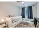 Cozy bedroom with neutral tones, a comfortable trundle bed, and natural light, creating a serene atmosphere at 113 Manzanita Falls Ave, North Las Vegas, NV 89031