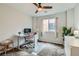 Bright bedroom featuring neutral tones, a practical workspace, and ample natural light at 113 Manzanita Falls Ave, North Las Vegas, NV 89031