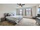 Primary bedroom featuring neutral tones, a comfortable bed, and natural light at 113 Manzanita Falls Ave, North Las Vegas, NV 89031