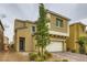 Charming two-story home featuring a well-manicured front yard and attached two-car garage at 113 Manzanita Falls Ave, North Las Vegas, NV 89031