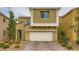 Attractive two-story house with a well-maintained lawn, a two-car garage, and paved driveway at 113 Manzanita Falls Ave, North Las Vegas, NV 89031