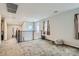 This loft area features carpeting, a modern railing and plenty of natural light from the windows at 113 Manzanita Falls Ave, North Las Vegas, NV 89031