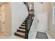 Contemporary staircase with metal railings and carpeted steps leading to upper floors at 113 Manzanita Falls Ave, North Las Vegas, NV 89031