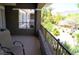 Relaxing balcony offering serene views of lush greenery and manicured landscaping at 11830 Portina Dr # 2030, Las Vegas, NV 89138