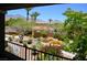 Scenic view from the balcony showcasing beautifully landscaped grounds and distant mountains at 11830 Portina Dr # 2030, Las Vegas, NV 89138