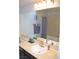 Bathroom featuring a large mirror, a vanity with sink, and a tub with shower at 11830 Portina Dr # 2030, Las Vegas, NV 89138