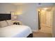 Bedroom featuring neutral colors, carpeted floors, and a glimpse into an adjoining space at 11830 Portina Dr # 2030, Las Vegas, NV 89138
