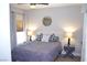 Bright bedroom with a large window, bedside lamps, and a neatly made bed at 11830 Portina Dr # 2030, Las Vegas, NV 89138