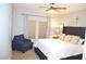Inviting bedroom with neutral decor, a ceiling fan, and an abundance of natural light at 11830 Portina Dr # 2030, Las Vegas, NV 89138