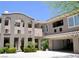 Modern townhome with a private entrance, garage, and beautiful desert landscaping at 11830 Portina Dr # 2030, Las Vegas, NV 89138