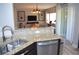 Open concept living space featuring granite countertops and stainless appliances at 11830 Portina Dr # 2030, Las Vegas, NV 89138