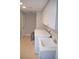 Bright laundry room with washer, dryer, utility sink, storage cabinets, and tile floor at 11830 Portina Dr # 2030, Las Vegas, NV 89138