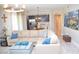 Comfortable living room showcasing a large sectional couch and views into the modern kitchen at 11830 Portina Dr # 2030, Las Vegas, NV 89138