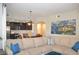 Open-concept living area flowing into a modern kitchen, featuring a comfortable sectional sofa at 11830 Portina Dr # 2030, Las Vegas, NV 89138