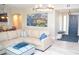 Open-concept living room with stylish decor and seamless transition to the entryway at 11830 Portina Dr # 2030, Las Vegas, NV 89138