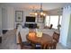 Inviting living room with modern lighting and decor, adjacent to dining area with round table at 11830 Portina Dr # 2030, Las Vegas, NV 89138