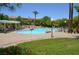Community pool with a pergola, plenty of lounge chairs, well-manicured landscaping and a serene setting at 11830 Portina Dr # 2030, Las Vegas, NV 89138
