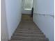 Carpeted stairs leading to the lower level at 11830 Portina Dr # 2030, Las Vegas, NV 89138