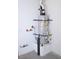 A.O. Smith water heater on a concrete pedestal with exposed piping and electrical connections against a white wall at 11830 Portina Dr # 2030, Las Vegas, NV 89138