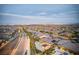 Breathtaking aerial view captures the vast cityscape and a home with a private backyard pool at 12168 Dorada Coast Ave, Las Vegas, NV 89138