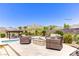 Inviting backyard features lounge chairs, fire pit, pool, pergola, and mountain views for outdoor enjoyment at 12168 Dorada Coast Ave, Las Vegas, NV 89138