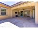 Inviting covered patio with tile flooring, ceiling fan, and convenient access to the home's interior at 12168 Dorada Coast Ave, Las Vegas, NV 89138