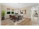 Dining room with modern chandelier, decorative art, and a large window at 12168 Dorada Coast Ave, Las Vegas, NV 89138