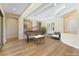 Elegant living room with tray ceilings and wood floors, showcasing a grand piano and stylish chair at 12168 Dorada Coast Ave, Las Vegas, NV 89138