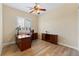 Well-lit office with wood floors, plantation shutters, and traditional dark wood furniture at 12168 Dorada Coast Ave, Las Vegas, NV 89138
