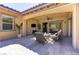 Covered patio offers comfortable seating and easy access to indoor living spaces in a staged presentation at 12168 Dorada Coast Ave, Las Vegas, NV 89138