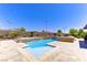 Backyard features a luxurious pool with water features and an outdoor seating area at 12168 Dorada Coast Ave, Las Vegas, NV 89138
