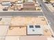A high-angle aerial shot captures a residential area with neatly arranged homes under a spacious, clear sky at 1328 Balzar Ave, Las Vegas, NV 89106
