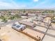 An aerial view displays a neighborhood street with residential houses and a view of the surrounding landscape at 1328 Balzar Ave, Las Vegas, NV 89106