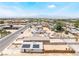 Aerial view showcases a home with solar panels, surrounded by a residential neighborhood under a clear blue sky at 1328 Balzar Ave, Las Vegas, NV 89106