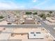 A high-angle aerial shot captures a residential area with neatly arranged homes under a spacious, clear sky at 1328 Balzar Ave, Las Vegas, NV 89106