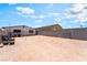 Wide backyard showcasing a temporary structure frame, bordered by brick walls and open area at 1328 Balzar Ave, Las Vegas, NV 89106