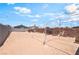 Spacious backyard with temporary structure frame, brick wall, and ample space at 1328 Balzar Ave, Las Vegas, NV 89106