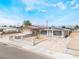 Charming single-story home with a fenced front yard, gray paint, and a desert landscape at 1328 Balzar Ave, Las Vegas, NV 89106