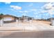 Single-story home featuring a white fence, long driveway, and minimal landscaping at 1328 Balzar Ave, Las Vegas, NV 89106