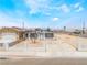 Charming single-story home featuring a spacious front yard with a paved driveway and a decorative white fence at 1328 Balzar Ave, Las Vegas, NV 89106